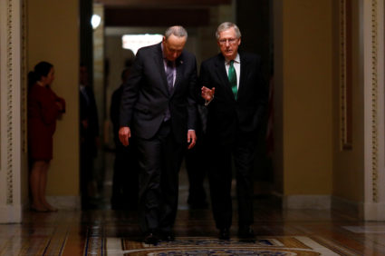 U.S. Senate Minority Leader Chuck Schumer (D-NY) and U.S. Senate Majority Leader Mitch McConnell (R-KY) walk to the Senate chamber on Capitol Hill in Washington, D.C., U.S., February 7, 2018. REUTERS/Eric Thayer - RC1FA5A1A240