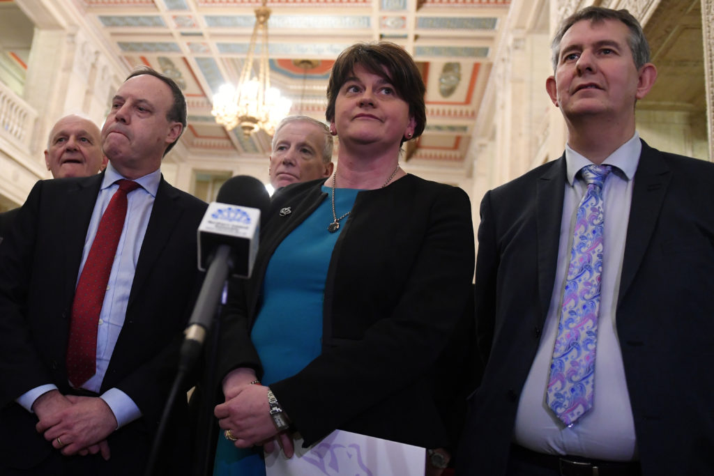 DUP leader Arlene Foster (center) arrives at a news conference in Parliament Buildings at Stormont in Belfast, Northern Ir...