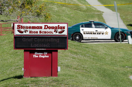 A message about grief counseling appears on the electronic signboard at Marjory Stoneman Douglas High School one day after a shooting at the school left 17 dead in Parkland, Florida, February 15, 2018. Photo by Jonathan Drake/Reuters