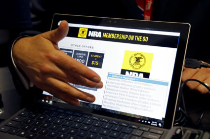 Attendees sign up for NRA memberships at the Conservative Political Action Conference (CPAC) at National Harbor, Maryland, U.S., February 22, 2018. REUTERS/Kevin Lamarque - RC1D7CFCABC0
