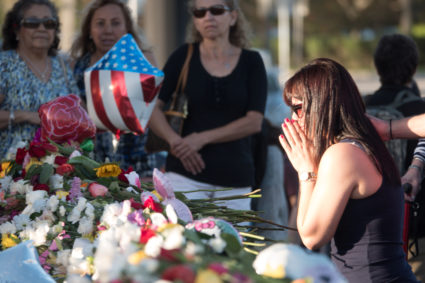 Well-wishers place mementos at the Marjory Stoneman Douglas High School following a mass shooting in Parkland, Florida. The school opens on Wednesday. Photo by Angel Valentin/Reuters