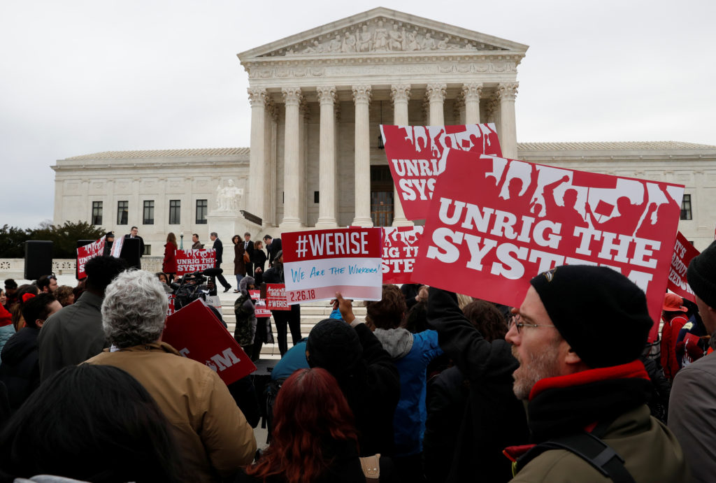 Union supporters rally outside of the United States Supreme Court in Washington on Feb. 26, 2018. Photo by REUTERS/Leah Mi...