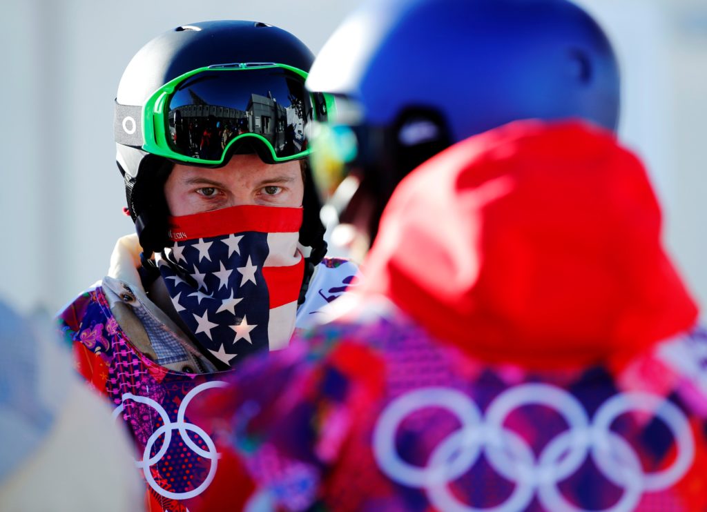 FILE PHOTO: U.S. snowboarder Shaun White waits in line during a breakdown of the chairlift at snowboard slopestyle trainin...