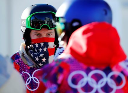 FILE PHOTO: U.S. snowboarder Shaun White waits in line during a breakdown of the chairlift at snowboard slopestyle training for the 2014 Sochi Winter Olympics in Rosa Khutor, February 3, 2014.Ê Ê REUTERS/Mike Blake/File Photo - RC170C633A70