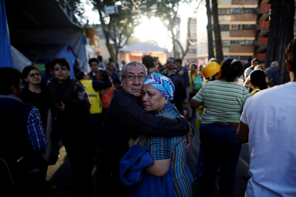 People react after an earthquake shook buildings in Mexico City, Mexico February 16, 2018. REUTERS/Edgard Garrido - RC19BB...