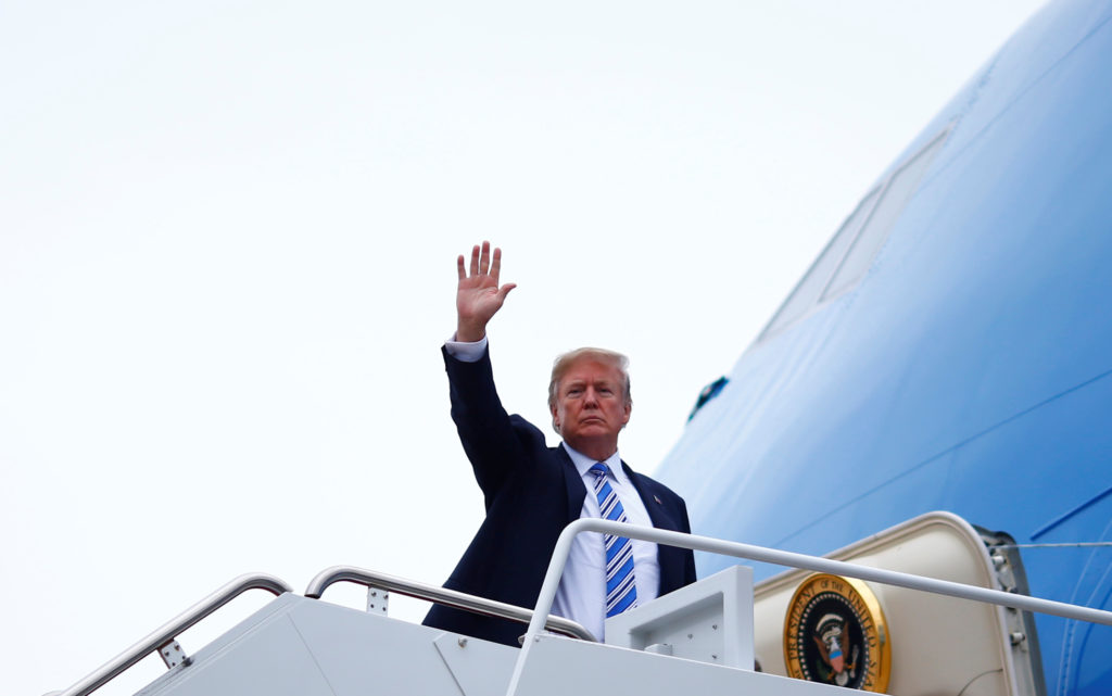 U.S. President Donald Trump boards Air Force One as he departs for West Palm Beach, Florida, from Joint Base Andrews, Mary...