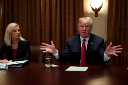 U.S. President Donald Trump, flanked by Secretary of Homeland Security Kirstjen Nielsen, meets with members of Congress and U.S. law enforcement about crime and immigration issues, specifically the MS-13 gang, at the White House in Washington, U.S. February 6, 2018. REUTERS/Jonathan Ernst - RC1C08636760