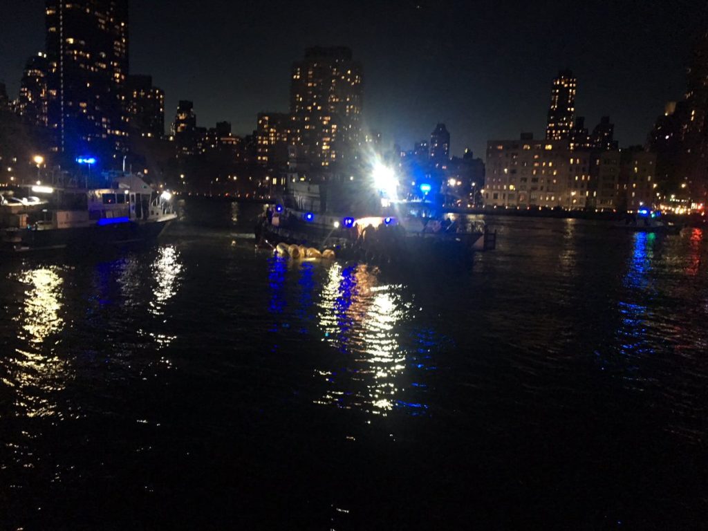 New York City Fire Department responds to a helicopter that crashed into the East River. Photo by New York City Fire Depar...
