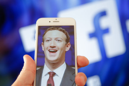 A portrait of Facebook found Mark Zuckerberg is seen on an iPhone in this photo illustration on 28 August, 2017. (Photo by Jaap Arriens/NurPhoto via Getty Images)