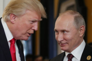President Donald Trump (L) chats with Russia's President Vladimir Putin as they attend the APEC Economic Leaders' Meeting, part of the Asia-Pacific Economic Cooperation (APEC) leaders' summit in the central Vietnamese city of Danang on November 11, 2017. / AFP PHOTO / SPUTNIK / Mikhail KLIMENTYEV (Photo credit should read MIKHAIL KLIMENTYEV/AFP/Getty Images)