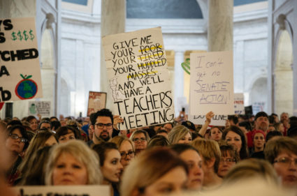 Striking school workers hold signs and chant inside the West Virginia Capitol last week in Charleston, West Virginia. Photo by Scott Heins/Bloomberg via Getty Images