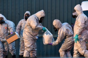 SALISBURY, ENGLAND - MARCH 08: Forensic police officers wearing hazmat suits examine a vehicle believed to belong to Sergei Skripal on March 8, 2018 in Salisbury, England. Police investigations continue into the use of a nerve agent to poison Sergei Skripal, who was found ill in a Salisbury park with his daughter on March 4. Both Sergei Skripal and his daughter remain in critical condition in hospital. Sergei Skripal was granted refuge in the UK following a spy swap between the US and Russia in 2010. (Photo by Rufus Cox/Getty Images)