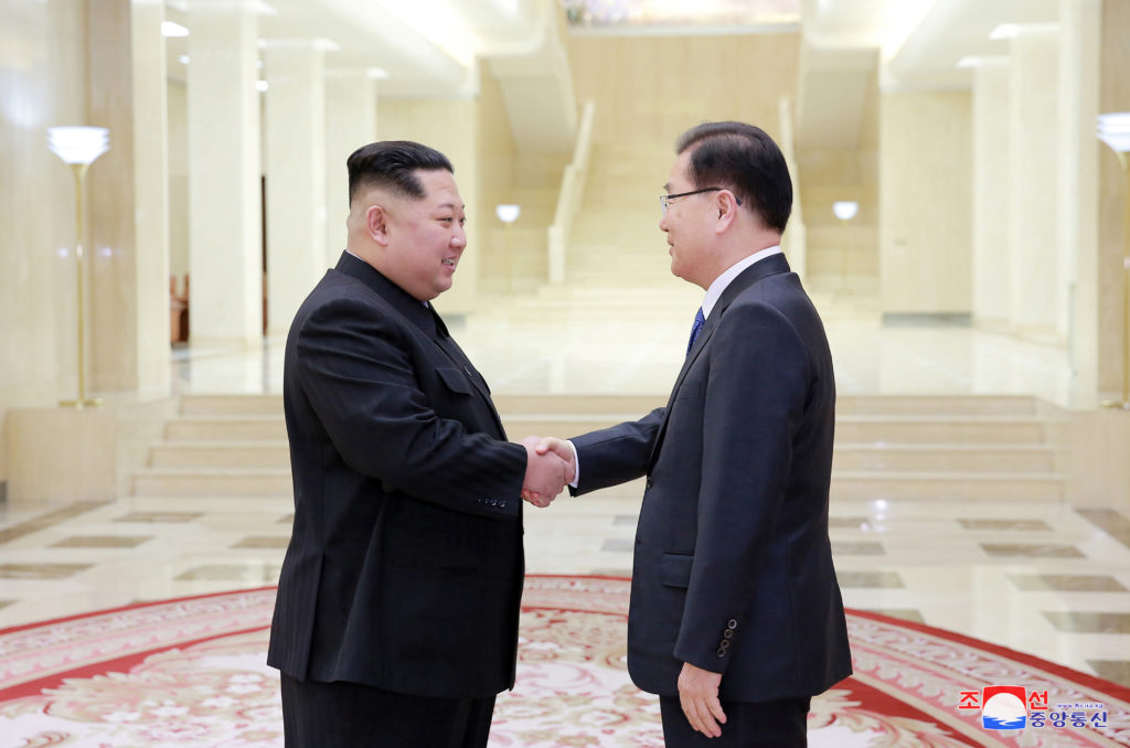 North Korean leader Kim Jong Un shakes hands with Chung Eui-yong who is leading a special delegation of South Korea's Pres...