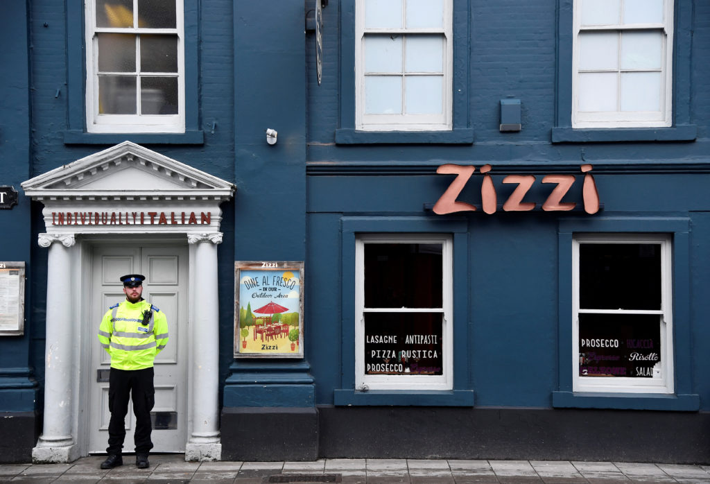 A police officer stands outside a restaurant which was closed after former Russian inteligence officer Sergei Skripal, and...