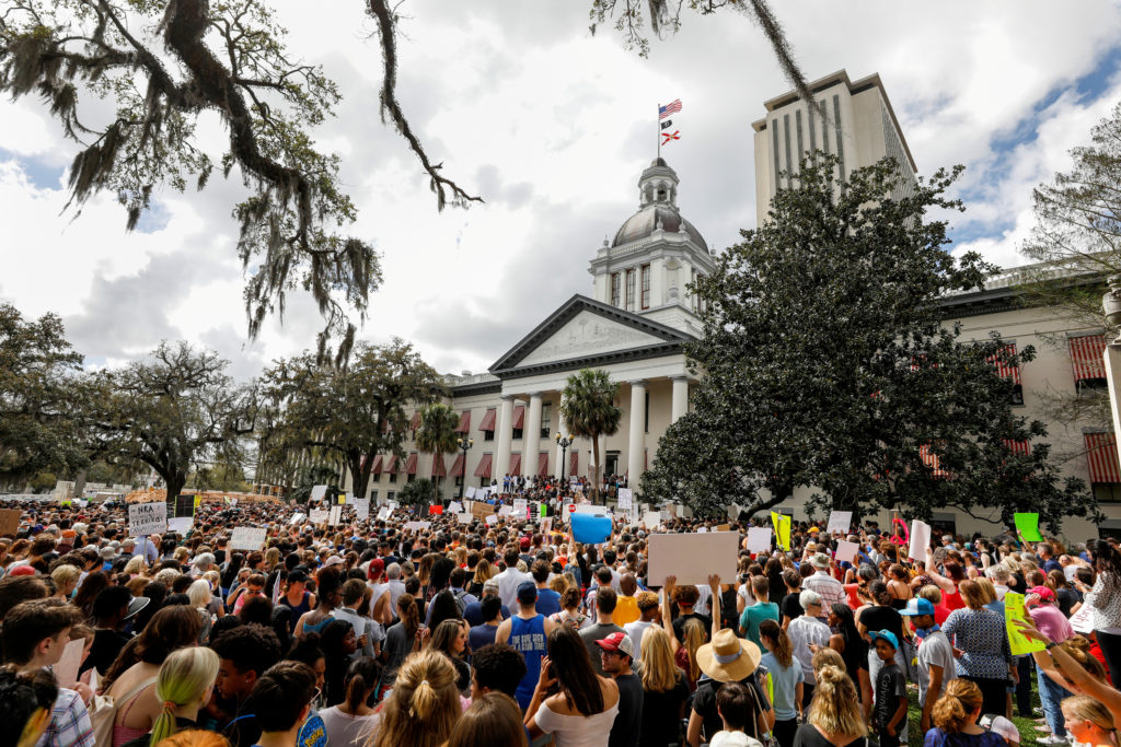 FILE PHOTO: Protestors rally outside the Capitol urging Florida lawmakers to reform gun laws, in the wake of last week's m...