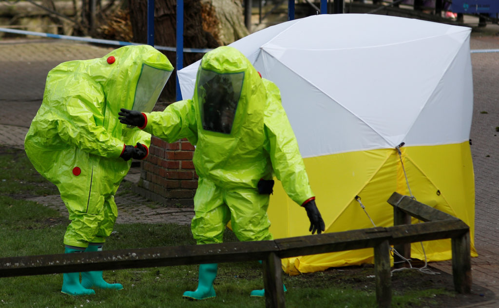 The forensic tent, covering the bench where Sergei Skripal and his daughter Yulia were found, is repositioned by officials...