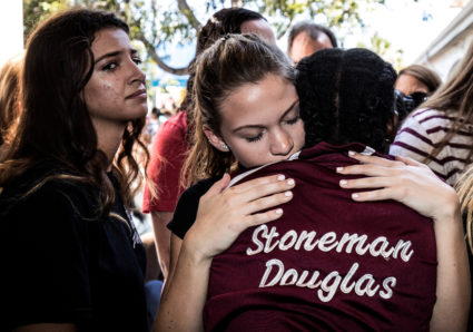 Students from Marjory Stoneman Douglas High School attend a memorial following a school shooting in Parkland, Florida, on Feb. 15. File photo by Thom Baur/Reuters