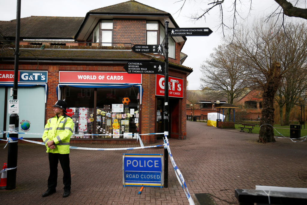 A police officer stands at a cordon around the bench where former Russian inteligence agent Sergei Skripal and his daughte...