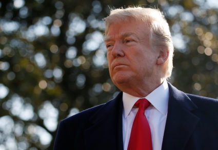 President Donald Trump speaks with the news media before boarding Marine One helicopter to depart for travel to California via Joint Base Andrews from the South Lawn of the White House in Washington, D.C. Photo by Leah Millis/Reuters