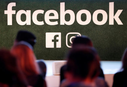 FILE PHOTO: A Facebook logo is seen at the Facebook Gather conference in Brussels, Belgium January 23, 2018. REUTERS/Yves Herman/File Photo - RC11B5E330B0