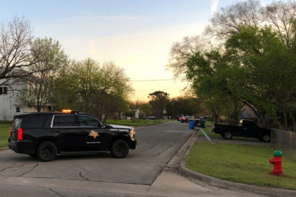 A Texas Department of Public Safety vehicle blocks a street into the neighborhood where the Austin bomb suspect may lived in Pfluggerville, Texas. Photo by Jon Herskovitz/Reuters