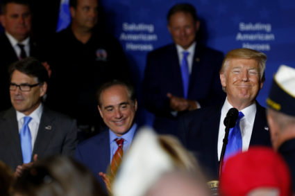 President Donald Trump, flanked by Energy Secretary Rick Perry (L) and Secretary of Veterans Affairs David Shulkin (2nd L), participates in a 2017 event celebrating veterans at AMVETS Post 44 in Struthers, Ohio. Photo by Jonathan Ernst/Reuters