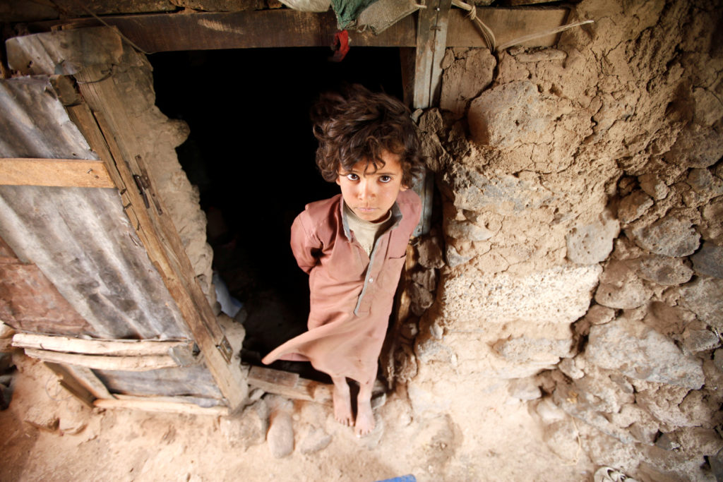 A boy stands inside a tent at a camp for people displaced by the war near Sanaa, Yemen, May 30, 2017. REUTERS/Mohamed al-S...
