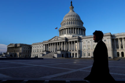 People walk by the U.S. Capitol building in Washington, D.C. Photo by Leah Millis/Reuters