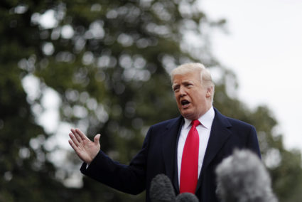 President Donald Trump speaks to the media about the school shooting in Parkland, Florida as he heads to the Marine One helicopter to depart the White House on his way to address the Conservative Political Action Conference (CPAC) in Washington, D.C. Photo by Jim Bourg/Reuters