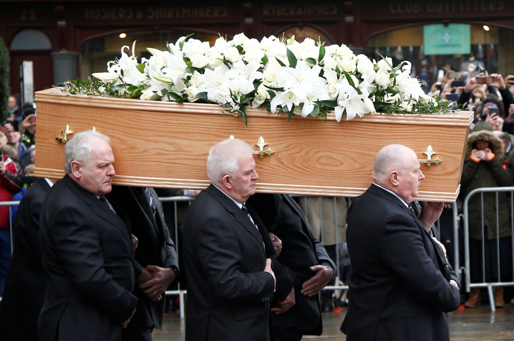 Pallbearers carry the coffin out of Great St Marys Church at the end of the funeral of theoretical physicist Prof Stephen Hawking, in Cambridge, Britain, March 31, 2018. REUTERS/Henry Nicholls - RC1B832CAC10