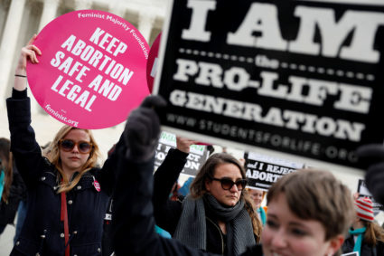 Pro-life and pro-choice activists gather at the Supreme Court for the National March for Life rally in Washington January 27, 2017. REUTERS/Aaron P. Bernstein - RC18896B8B20