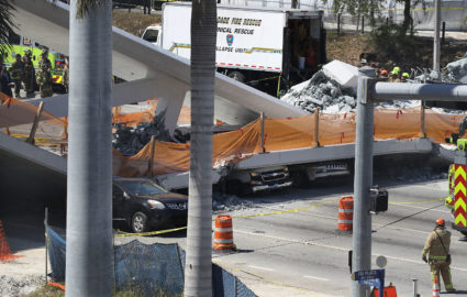 MIAMI, FL - MARCH 15: Vehicles are seen trapped under the collapsed pedestrian bridge that was newly built over southwest 8th street allowing people to bypass the busy street to reach Florida International University on March 15, 2018 in Miami, Florida. Reports indicate that there are an unknown number of fatalities as a result of the collapse, which crushed at least five cars. (Photo by Joe Raedle/Getty Images)