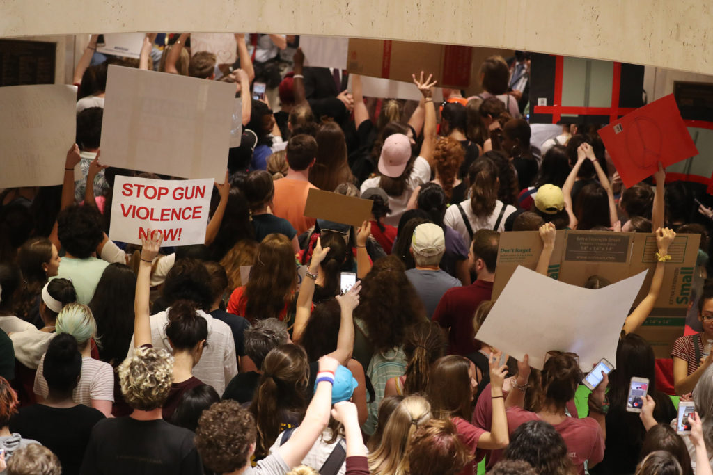 After no luck at the governor's office, students storm the Florida House of Representatives chambers in Tallahassee, Fla. ...