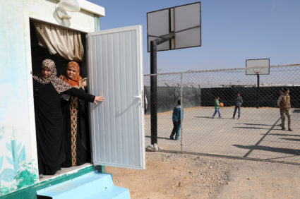 Syrian refugees peep out from a door in Al Zaatari refugee camp during United Nations Secretary General Antonio Guterres' visit to the camp near Mafraq, Jordan near the border with Syria March 28, 2017. REUTERS/Ammar Awad