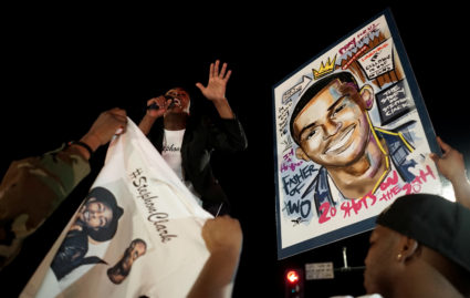 Stevante Clark, brother of Stephon Clark, speaks to the crowd during a vigil to protest the police shooting of Stephon Clark, in Sacramento, California. Photo by Bob Strong/Reuters