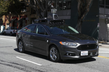 An Uber self-driving car drives down 5th Street on March 28, 2017 in San Francisco, California. Cars in Uber's self-driving cars are back on the roads after the program was temporarily halted following a crash in Tempe, Arizona on Friday. Photo by Justin Sullivan/Getty Images