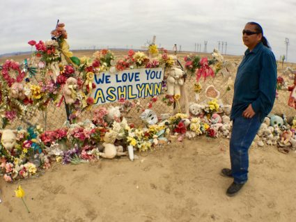 Gary Mike stands at a memorial for his daughter Ashlynne, who was killed on the Navajo Indian Reservation. Photo by Jenni Monet