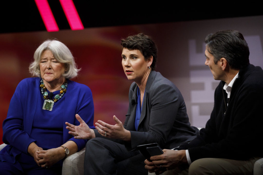 Amy McGrath, former U.S. Marine and Democratic congressional candidate from Kentucky, center, speaks as Patricia Schroeder...