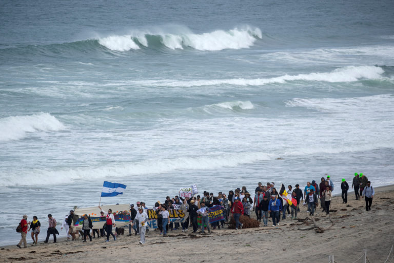 Buses carrying Central American migrants roll to U.S. border | PBS News