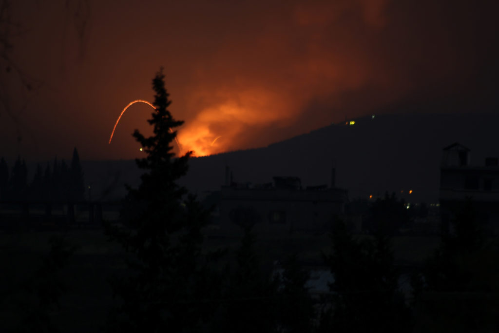 Fire and explosions are seen in what purported to be the Mountain 47 region, countryside south of Hama city, Syria, April ...