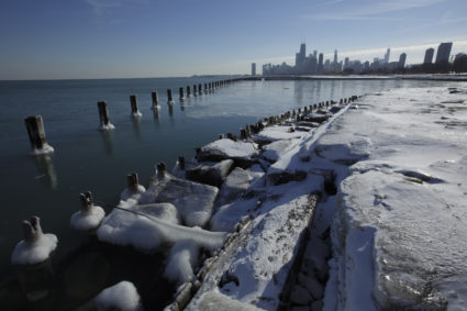 Ice covers the shore of Lake Michigan in Chicago, December 12, 2013. REUTERS/John Gress