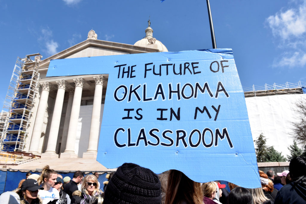 Teachers rally outside the state Capitol during a teacher walkout to demand higher pay and more funding for education in Oklahoma City. A surge in activism among teachers is shaking up the 2018 midterm elections. Photo by Nick Oxford/Reuters