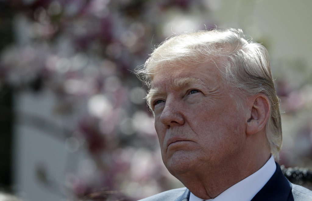 President Donald Trump listens during an event on tax cuts in the Rose Garden of the White House in Washington, D.C. Photo...