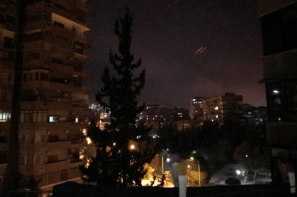 Anti-aircraft fire is seen over Damascus, Syria early April 14. Photo by Feras Makdesi/Reuters