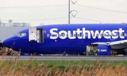 Emergency personnel monitor the damaged engine of Southwest Airlines Flight 1380, which diverted to the Philadelphia International Airport this morning after the airline crew reported damage to one of the aircraft's engines, on a runway in Philadelphia, Pennsylvania U.S. April 17, 2018. REUTERS/Mark Makela