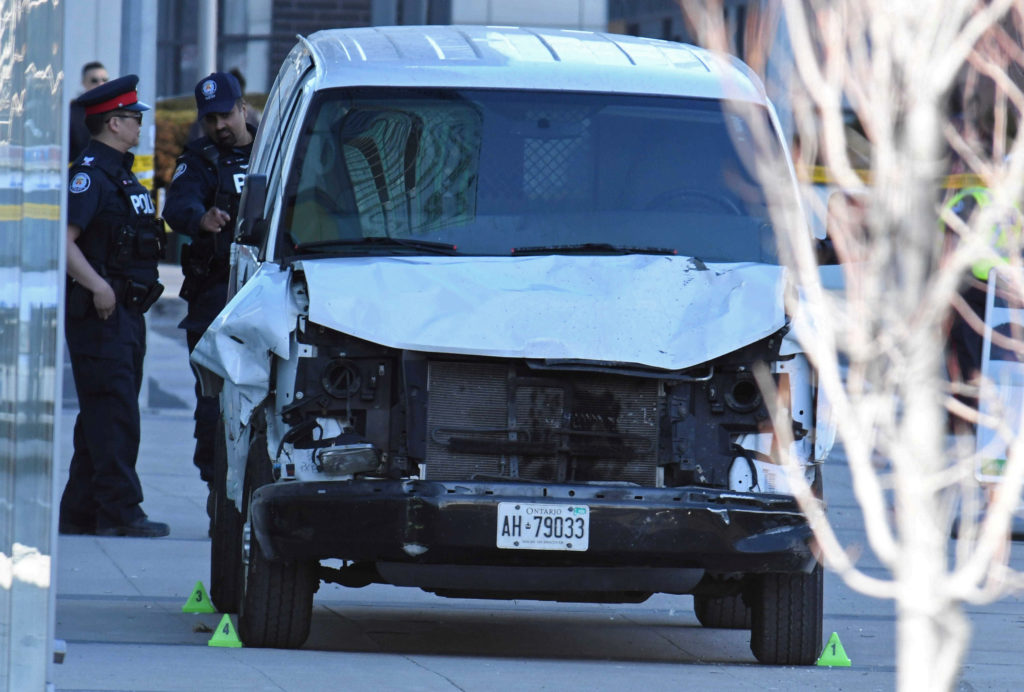 A damaged van seized by police is seen after multiple people were struck at a major intersection northern Toronto, Ontario...