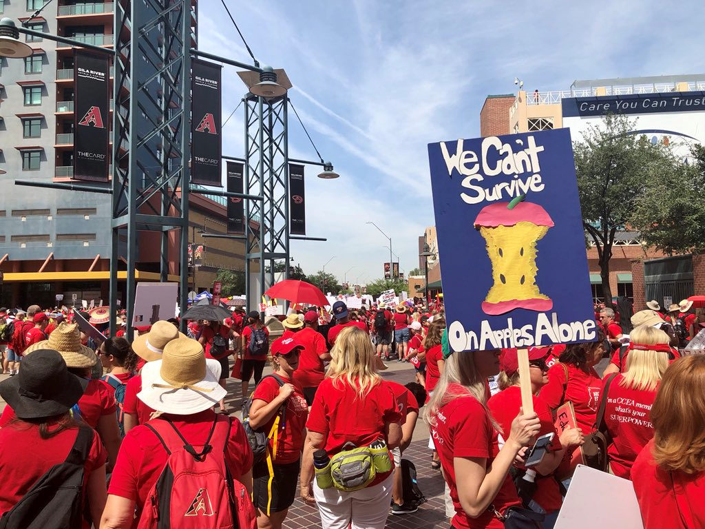 Participants take part in a march in Phoenix, Arizonia, U.S., April 26, 2018 in this picture obtained from social media. C...