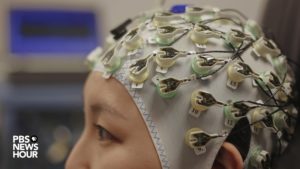 Luana Colloca's lab at the University of Maryland, Baltimore uses electroencephalography (pictured) and functional magnetic resonance imaging (fMRI) to study how placebos influence pain relief. Photo by Matt Ehrichs
