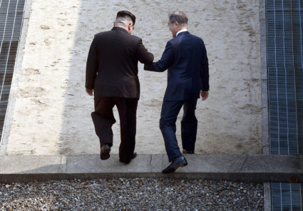 South Korean President Moon Jae-in and North Korean leader Kim Jong Un arrive at the Peace House in the truce village of Panmunjom inside the demilitarized zone separating the two Koreas, South Korea, April 27, 2018. Korea Summit Press Pool/Pool via Reuters - RC18ED355B30