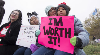 OKLAHOMA CITY, OK - APRIL 2: Natalie Armstrong (left) and her two daughters Payton and Payzlyn, along with her mother Katrina Sinor rally at the state capitol on April 2, 2018 in Oklahoma City, Oklahoma. Thousands of teachers and supporters are scheduled to rally Monday at the state Capitol calling for higher wages and better school funding. Armstrong said she has spent $3,000 this year for school supplies Teachers are walking off the job after a $6,100 pay raise was rushed through the Legislature and signed into law by Gov. Mary Fallin. (Photo by J Pat Carter/Getty Images)
